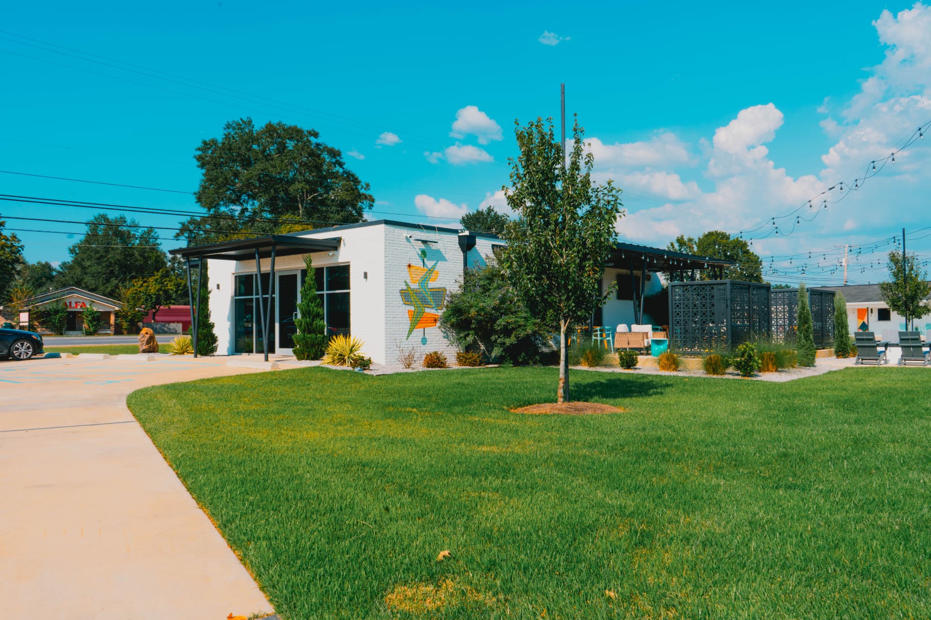 The Riviera lobby and lawn under a bright blue sky